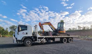 Excavator on a tow truck - Tilt Tray Transport - Taylored Automotive